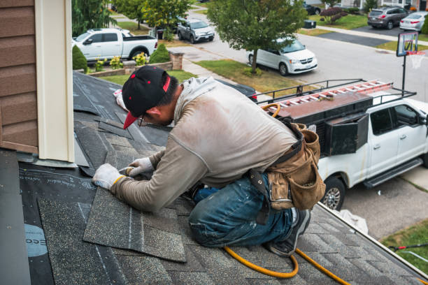 Professional Roofing technician working in Comstock Northwest, MI